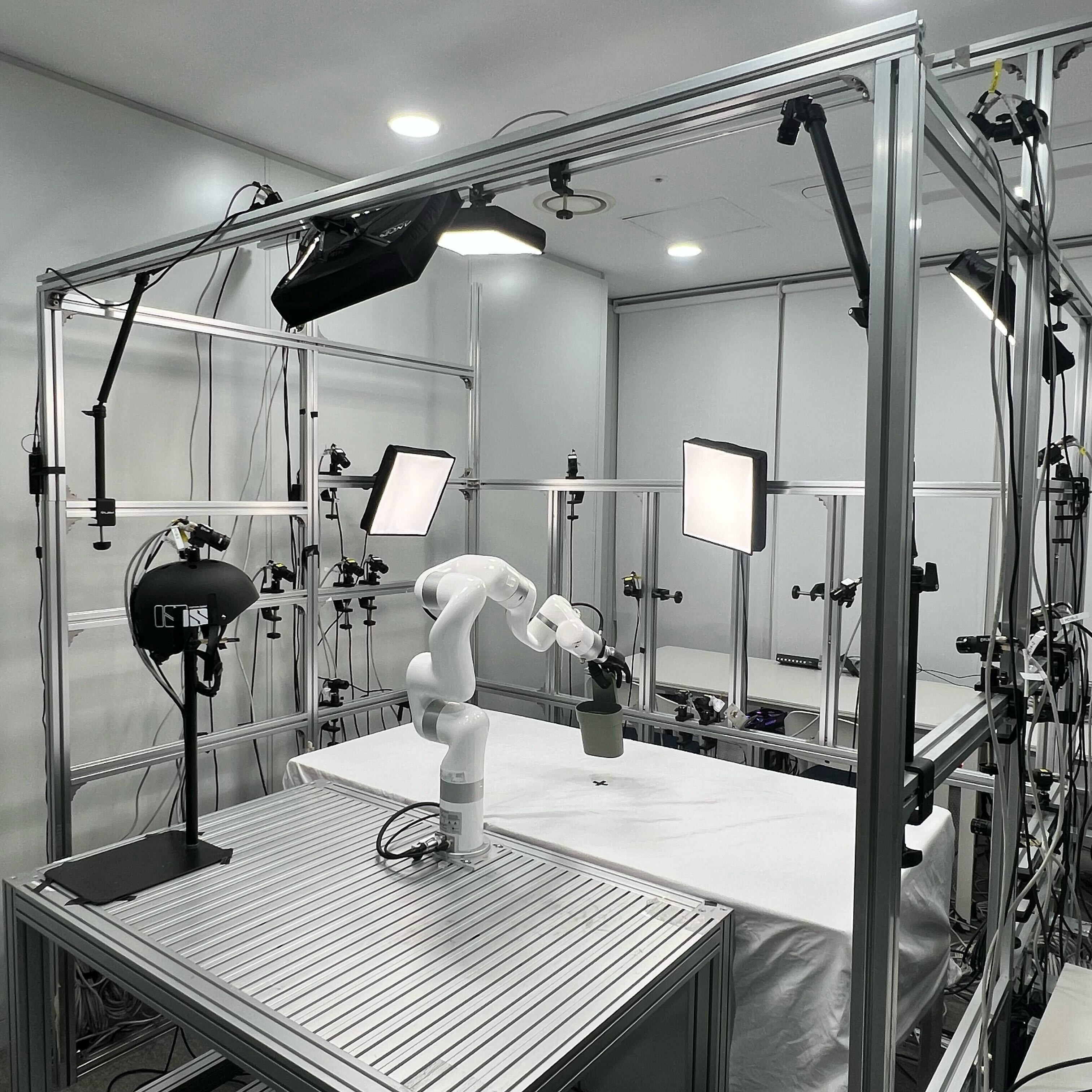 Dexterous robot hand grasping a cup in the HRDexDB capture setup